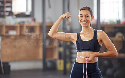 Buy stock photo Slim, fit and weightloss with woman holding measuring tape around waist and flexing her muscles to celebrate losing weight and achieving her goal. Smiling female athlete happy about diet and exercise