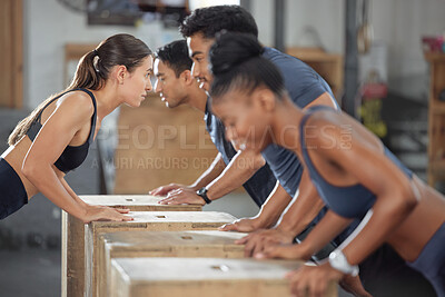 Buy stock photo Fitness, exercise and accountability group training and exercising together with wooden boxes at the gym. Diverse people and fit athletic friends looking serious and cross during a workout