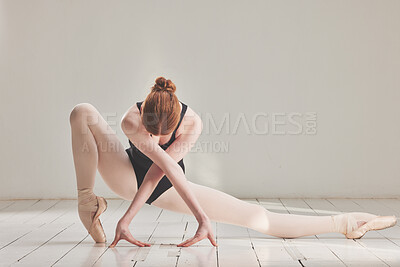 Buy stock photo Female ballet dancer in professional ballerina dance posture, dancing or difficult performance in studio rehearsal. Performing artist in point shoes and flexible legs, arms or art technique on floor