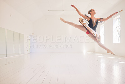 Buy stock photo Jumping or leaping female ballerina, ballet dancer or performer in a traditional tutu dress costume in a studio with copy space background. Young professional performer dancing in ballon mid air pose