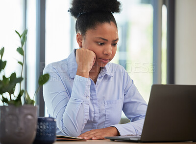 Buy stock photo Serious, frustrated and thinking while waiting and working on a laptop with slow internet or wifi connection in an office. Black female entrepreneur looking worried about mistake or glitch online