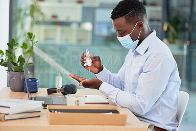 Buy stock photo Hygiene, compliance and covid rules at work with a business man sanitize hands before a shift. Professional male worker cleaning hand before going online with marketing project or design