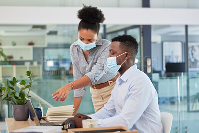 Buy stock photo Covid, masks and safety in the workplace of business people working together during a pandemic in an office. Manager, trainer or mentor training businessman how to use software on laptop.