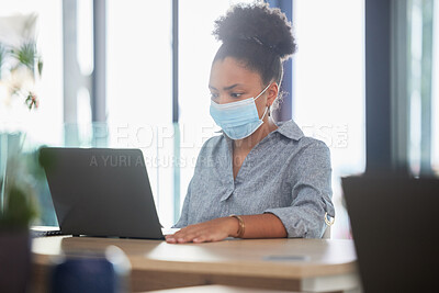Buy stock photo Covid, face mask and a black woman working on a laptop in a modern office. Sick businesswoman on the internet at work. College student, online exam and in campus library, protected against the virus.