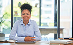 Proud and relaxed business woman with a positive mindset, mission and vision at the office. Portrait of a young female employee smiling ready for work sitting at her desk smiling
