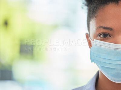 Buy stock photo Humanity, care and protection person in covid mask with half face pose on bokeh or blurred healthcare background. Hygiene woman covering face to stop the spread of virus or disease