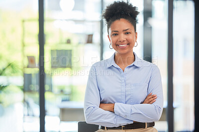 Buy stock photo Success, leadership and professional businesswoman smiling while in a modern corporate office. Portrait of a confident worker, manager and young female leader standing with crossed arms at a company.