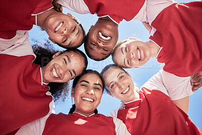 Buy stock photo Female soccer team in a huddle smiling in unity and support in a circle. Below portrait of an active and diverse group of women football players or athletes happy and excited for a sports match 
