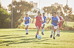 Female football, sports and team playing match on a field while passing, touching and running with a ball. Active, fast and skilled soccer players in a competitive game on a pitch outdoors.