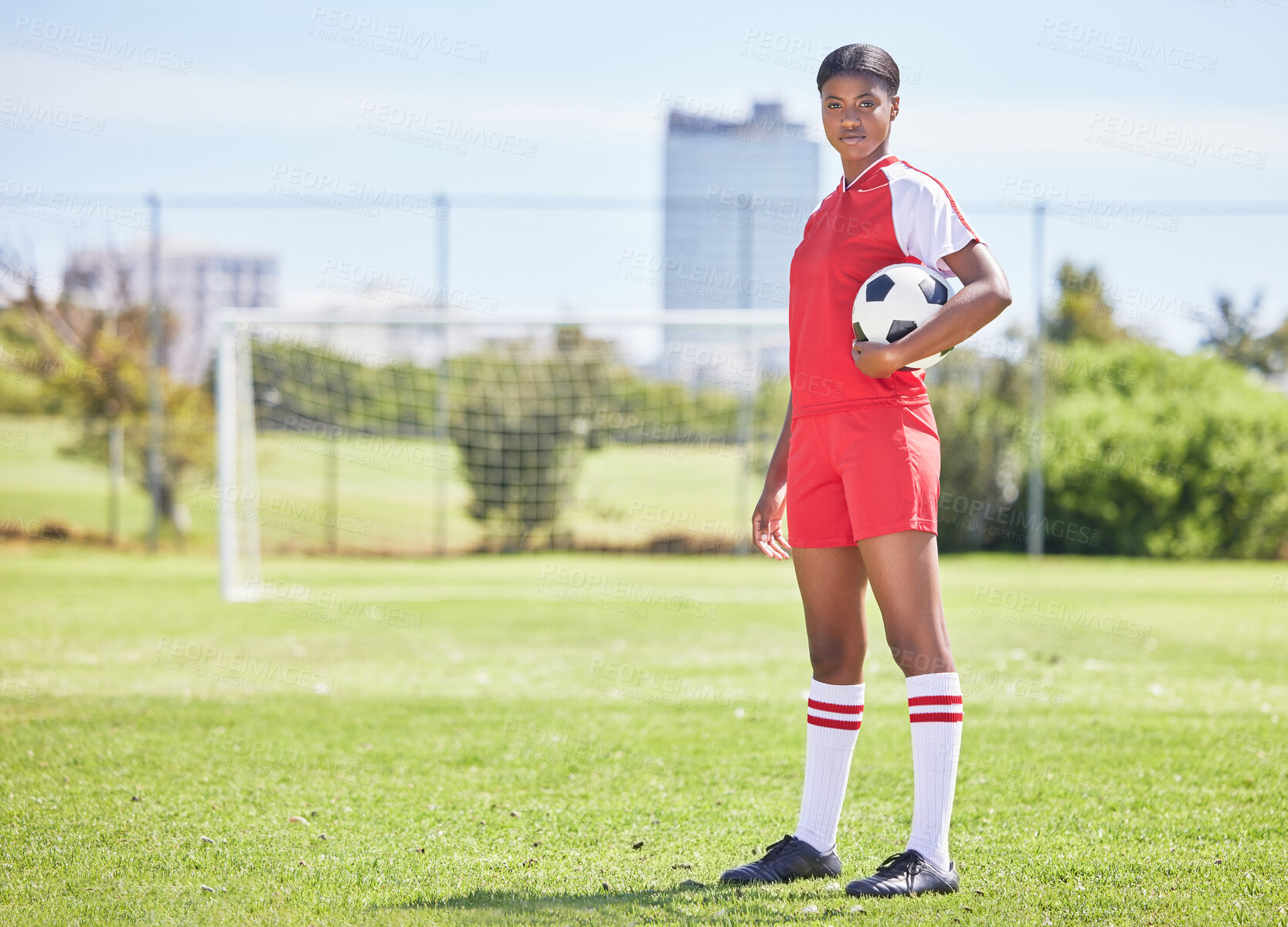 Buy stock photo Sports, woman athlete and soccer player training at stadium grass football field with goal post. Determined exercise, fitness player getting ready for next tournament game match standing on pitch