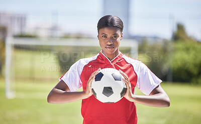 Buy stock photo Soccer, football and sports with player, woman and athlete ready for a match, game or competition with ball on a pitch, field or stadium outdoor. Portrait of serious black female ready for training