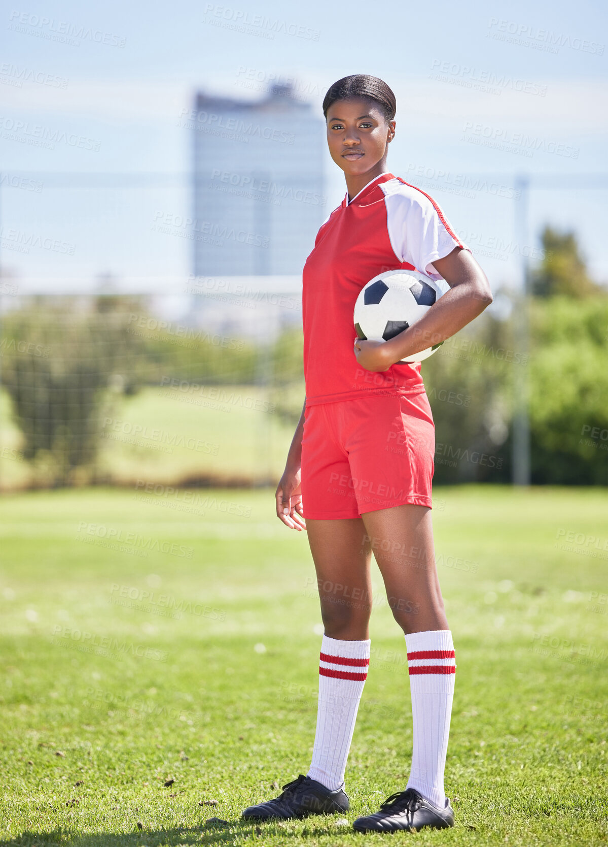 Buy stock photo Strong and confident soccer football female player with ball for practice and training on sports field. Portrait of determined and competitive woman in sport kit ready for game or match to start