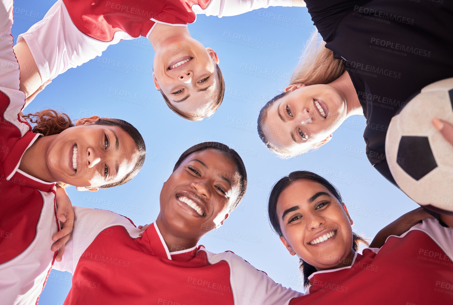 Buy stock photo A soccer team of females only in a huddle during a match happy about winning the competition. Low angle portrait of a women's football squad standing in a circle in unity and support as game strategy