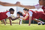 Women soccer, football or team sports holding hands in unity, support or motivation in routine workout, exercise or training drill. Diverse group of fit, active or healthy athletes and girls on field