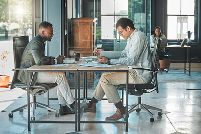 Buy stock photo Colleagues, coworkers or male employees collaborating and planning a business growth strategy together in an office. Happy corporate professionals working on a project proposal at a modern workplace