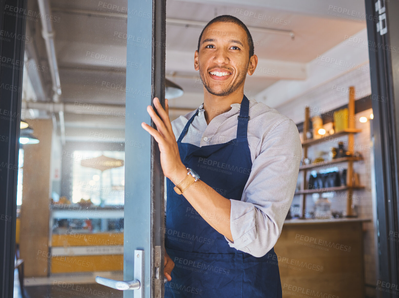 Buy stock photo Opening store, entrance door and welcome to cafe, coffee shop or small business. Happy male manager, proud store entrepreneur and hospitality worker ready for success and service in an open startup
