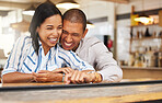 Couple laughing at funny joke at restaurant, friends bonding with smile on romantic date and celebrating anniversary at a coffee shop. Husband and wife showing love, having fun at cafe and talking