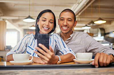 Buy stock photo Happy couple on a video call on phone, bonding on a coffee date at a cafe or restaurant, taking a selfie. Young girlfriend and boyfriend browsing online, checking social media and relaxing together 