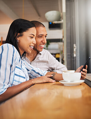 Buy stock photo Happy couple reading social media on phone, bonding on a coffee break at a care. Smiling boyfriend and girlfriend browsing online, checking for discount and booking, enjoying free time off on weekend
