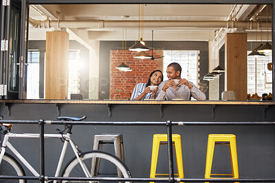 Buy stock photo Happy couple sitting at a coffee shop on a fun date at a cafe or restaurant with peace. Woman and man at a table relax, laugh and drink together with a smile loving love, romance and happiness