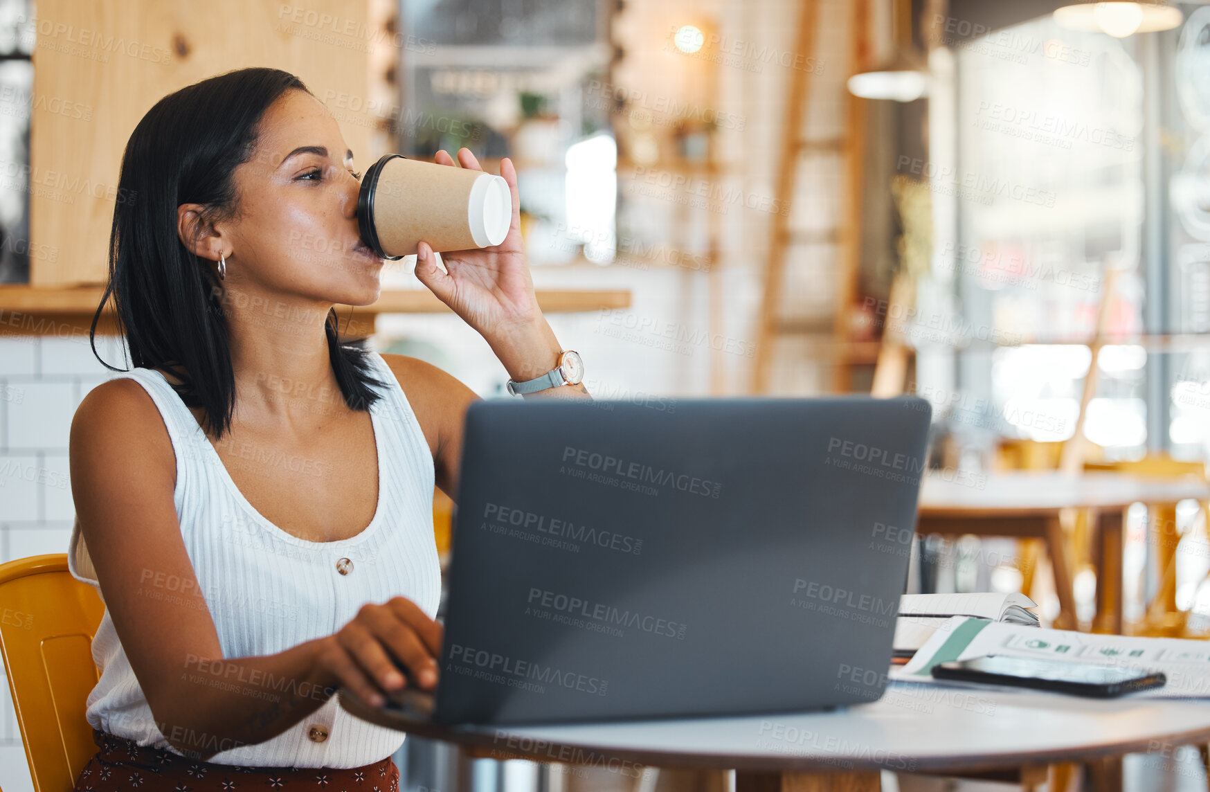 Buy stock photo Entrepreneur drinking tea while working on laptop at cafe, woman reading emails online and person enjoying a remote work space at a restaurant. Thinking female browsing the internet at coffee shop