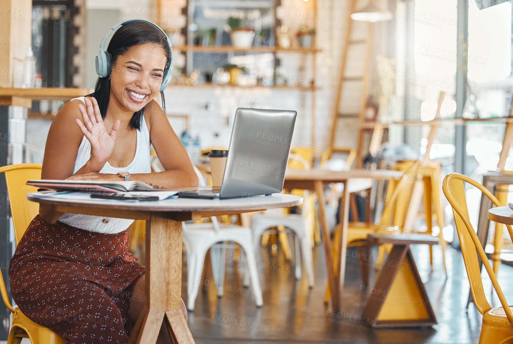 Buy stock photo Webinar meeting at internet cafe with woman on laptop video call with headphones waving, greeting webcam in coffee shop. Business freelance worker with smile in zoom meeting for remote global company