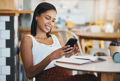 Buy stock photo Texting a message or browsing social media on a phone by a young female student sitting in a coffee shop smiling. A relaxed woman relaxing and searching the internet or chatting online at a cafe