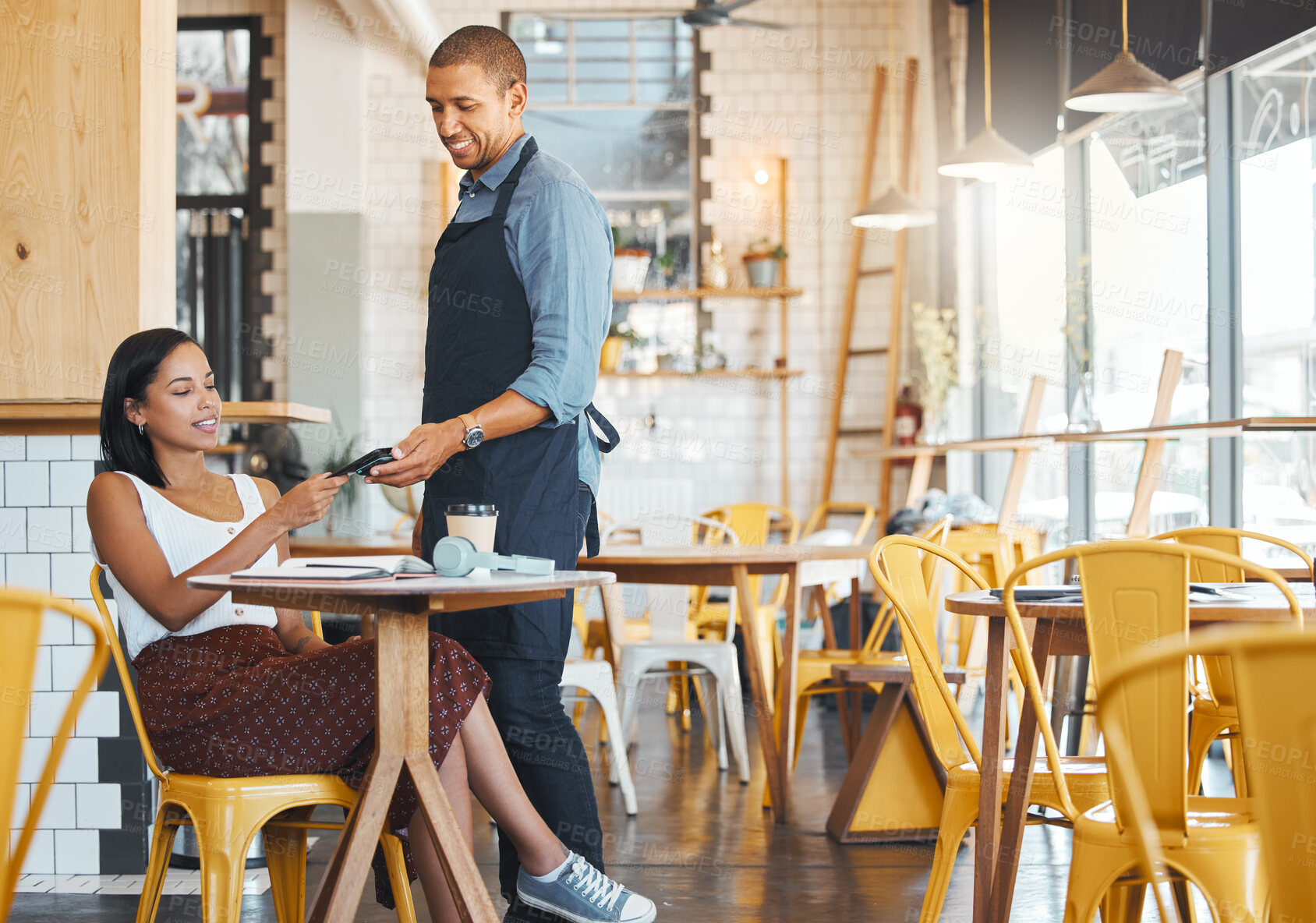 Buy stock photo Waiter, retail and coffee shop customer tapping phone on machine for secure and easy mobile payment at cafe store. Trendy small business owner using snap scan transaction to pay for goods or service