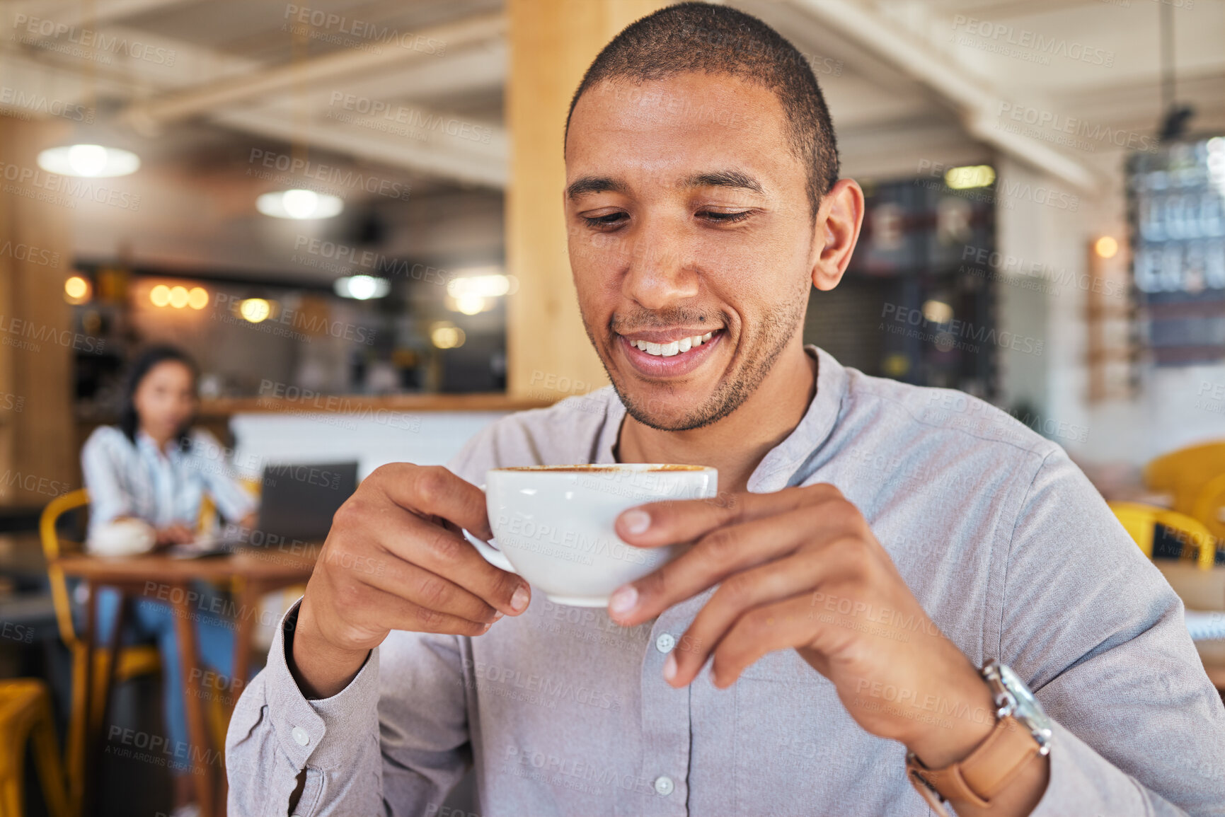Buy stock photo Man enjoying a cup of coffee, while smiling and sitting at a cafe relaxing. Businessman drinking tea or caffeine at restaurant. Relaxed and happy male holding a mug or beverage in a coffee shop


