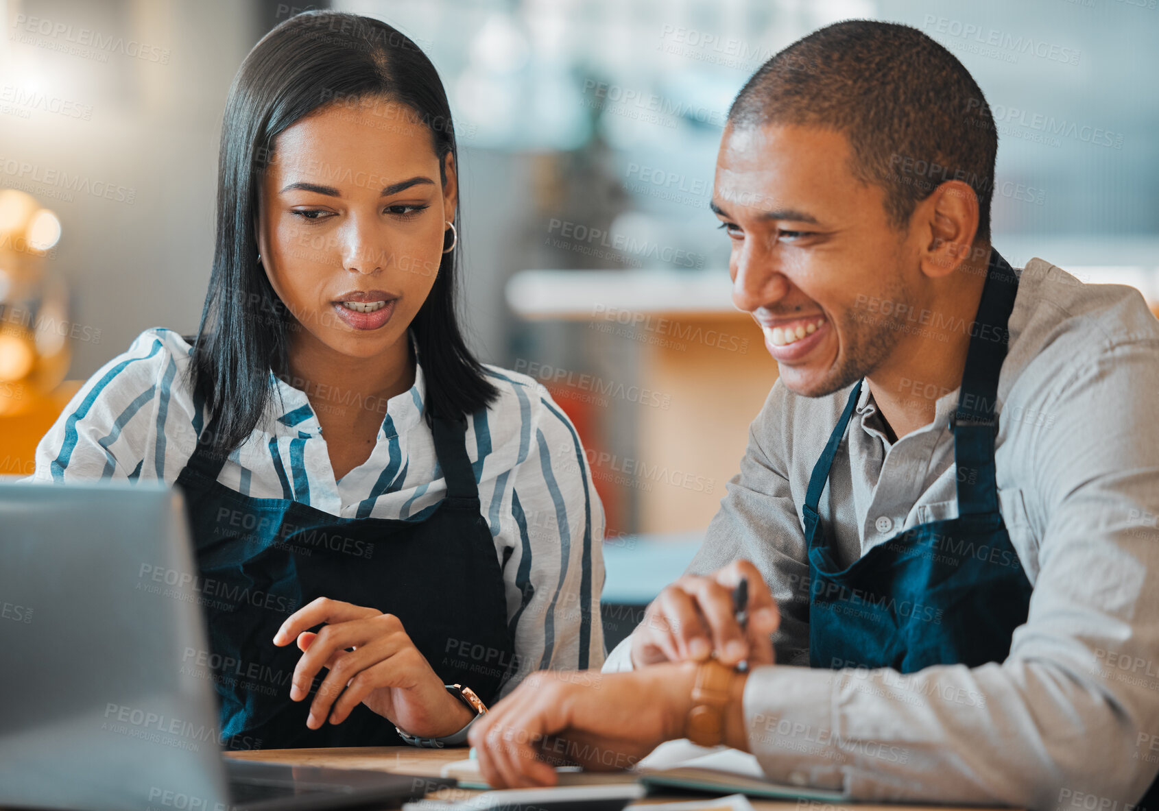 Buy stock photo Waiter, laptop and cafe restaurant manager in small business meeting with employee for financial budget or inventory. Coffee shop, bakery worker planning or review marketing or advertising strategy
