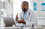 Telemedicine, healthcare and video call with doctor talking on laptop to online patient during a consultation. Happy black professional offering support or medical advice during a medical appointment