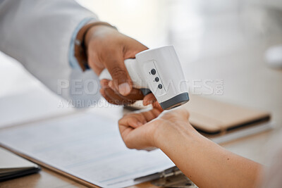 Buy stock photo Medical doctor measure with infrared digital thermometer in a clinic consulting appointment for covid. Healthcare worker check for coronavirus for health and safety in hospital office


 
