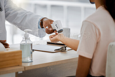 Buy stock photo Doctor check covid fever with laser thermometer of sick patient to test for risk of disease or flu in clinic surgery. Closeup on hands consulting for healthcare and virus safety in medical hospital