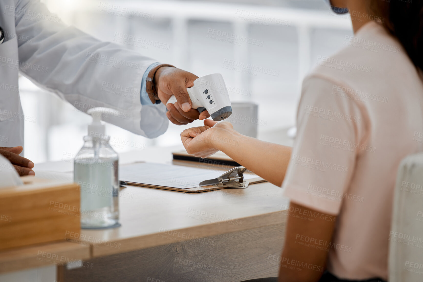 Buy stock photo Doctor check covid fever with laser thermometer of sick patient to test for risk of disease or flu in clinic surgery. Closeup on hands consulting for healthcare and virus safety in medical hospital