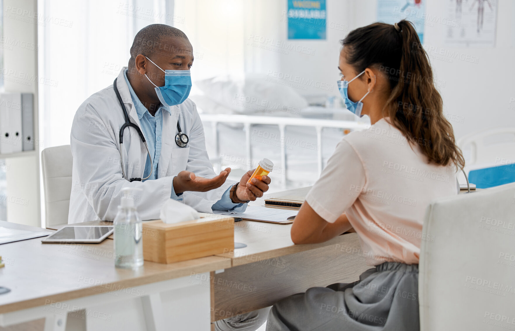 Buy stock photo Talking doctor, covid patient and pills or medicine in medical consultation, checkup and visit in clinic, hospital and healthcare center. Professional gp and worker explaining side effects to woman 