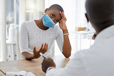 Buy stock photo Stressed, post covid or sick patient at a doctor appointment due to covid symptoms and headache. Covid19 fatigue and unhealthy woman talking to healthcare or medical worker about at a hospital
