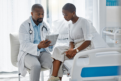 Buy stock photo Doctor consulting patient with digital tablet, discussing diagnosis and medical checkup in hospital. Healthcare worker and trusted physician in appointment with medicine advice, wellness and feedback