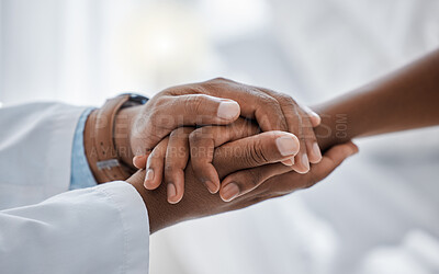 Buy stock photo Support, trust and hospital care with a doctor and patient holding hands, sharing bad news of a cancer diagnosis. Kind doctor offering a loving gesture to a sick person during a health crisis