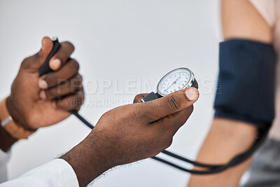 Buy stock photo Blood pressure or hypertension test by a healthcare professional on a female at the clinic or hospital. Closeup of a medical worker or GP checking a hypertensive woman or patient using a tensiometer