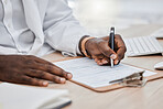 Doctor writing a prescription or treatment list in his office and working on a health document. Closeup of a healthcare black male professional or GP signing a medical contract at the workplace