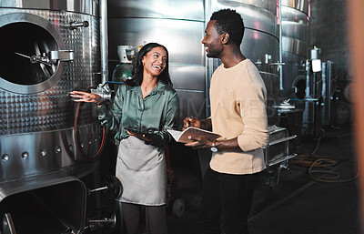Buy stock photo Wine business manufacturing warehouse factory, winery tank cellar brewery warehouse. Happy female winemaker employee at work b2b, ferment grape fruit storage
process and partner company meeting job