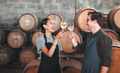 Buy stock photo Wine, glass and toast with a couple who drink alcohol in a cellar, distillery or winery estate together. Farming, collaboration and teamwork with a man and woman drinking and doing a cheers as a team