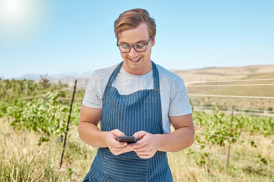 Buy stock photo Phone, farm and wine with a farmer or winemaker gets good news online in vineyard. Sustainability, development and ecommerce in farming. Leader in alcohol, agriculture and manufacturing industry