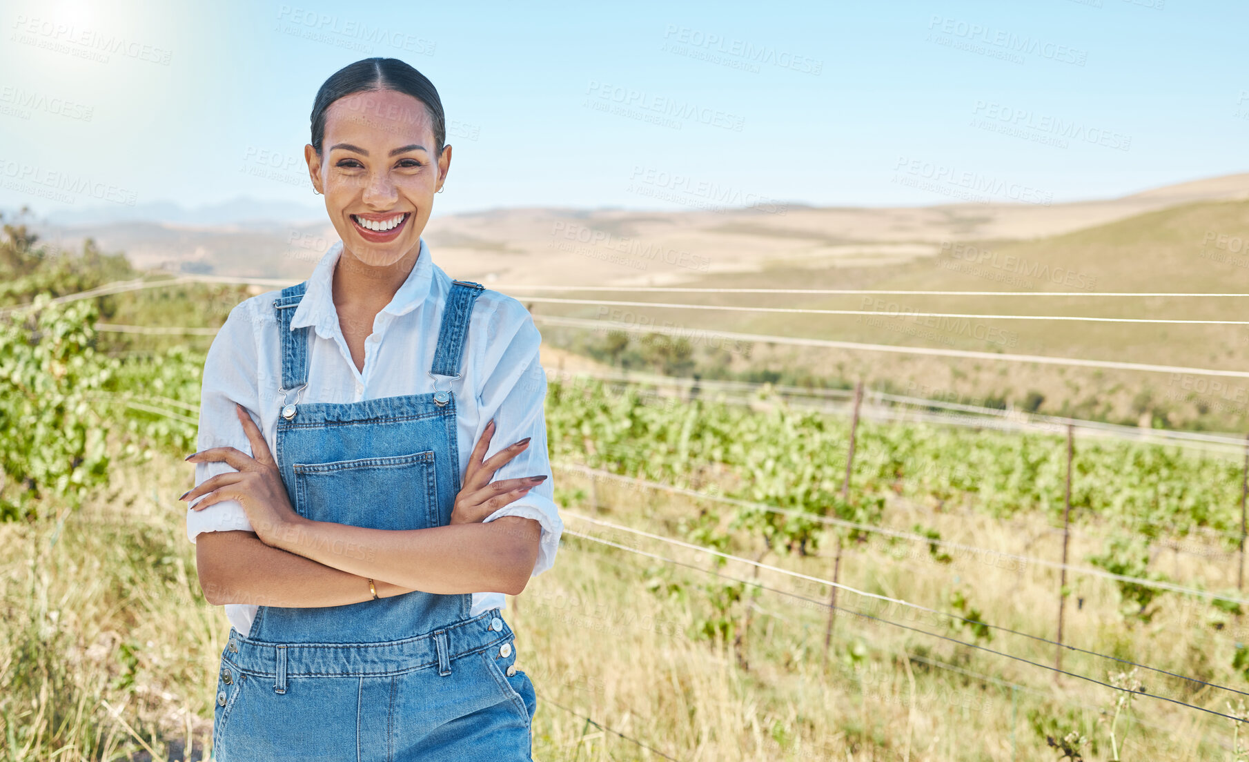 Buy stock photo Woman farming on a farm for sutainable living, eco friendly lifestyle and motivation for sustainability in natural environment in countryside. Portrait of happy farmer with arms crossed on green land