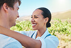 Love, countryside and couple smile, loving and bonding together on a sunny wine farm field and nature agriculture. Interracial, summer and happy man and trustworthy woman on a holiday vacation trip