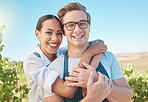 Interracial couple, love and happy man and woman in hug or embrace on wine tasting farm. Portrait of fun, trust or playful people on sustainability countryside, vineyard estate and agriculture field