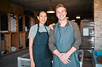 Ceo, wine people or couple and store workers in their wine distillery cellar background. Portrait, man and woman winery employees with happy smile working at warehouse, factory or vineyard industry

