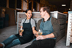 Laughing couple, wine tasting date and drinking alcohol with glasses in remote farm distillery, winery estate or countryside. Happy, flirt or bonding interracial man and woman enjoying vineyard drink