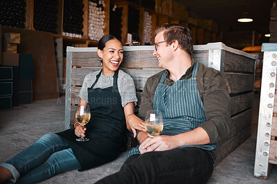 Buy stock photo Laughing couple, wine tasting date and drinking alcohol with glasses in remote farm distillery, winery estate or countryside. Happy, flirt or bonding interracial man and woman enjoying vineyard drink
