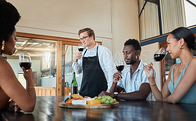Buy stock photo Hospitality, luxury and wine tasting at a restaurant with a professional sommelier teaching how to enjoy red wine. Diverse group having fun, celebrating their friendship with getaway and fine dining